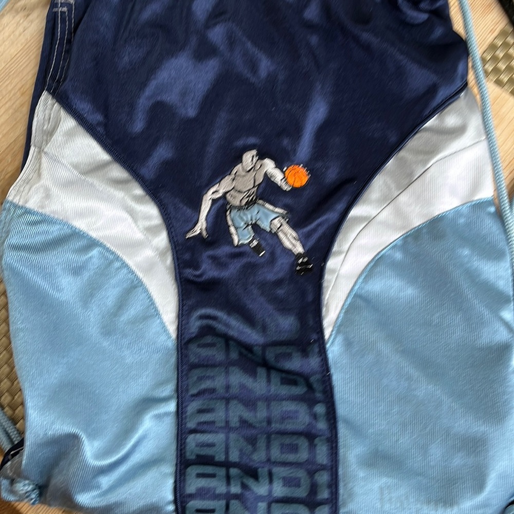 AND1 drawstring backpack bag. Basketball motif